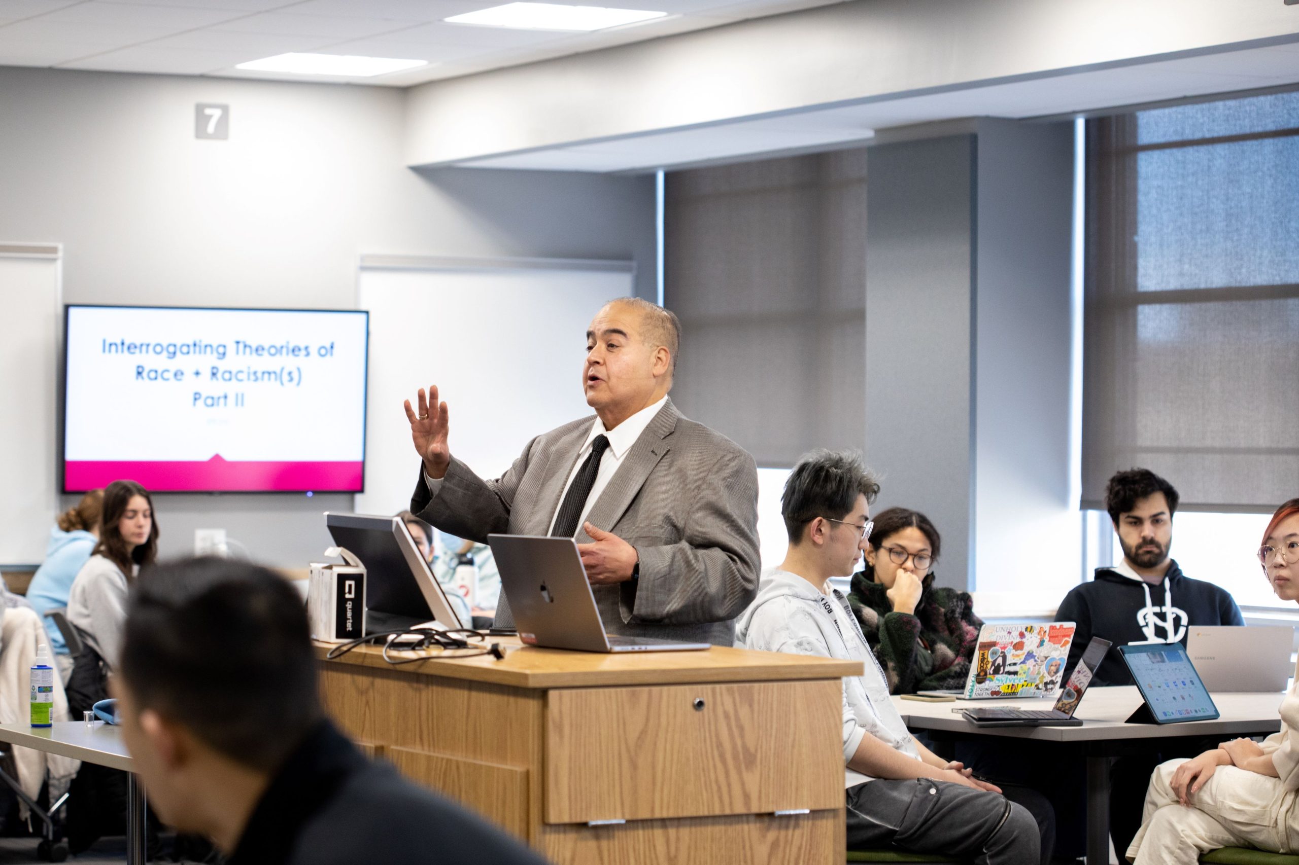 Dr. Anthony Hernandez lecturing undergraduate students in ED POL 210