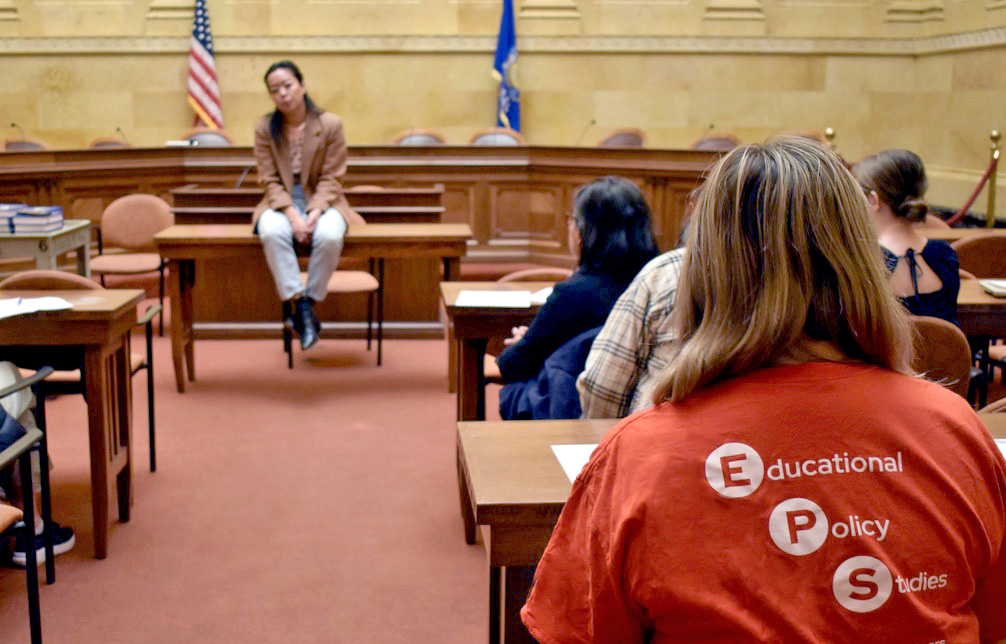 Students sitting in a room at the capital speaking to a representative