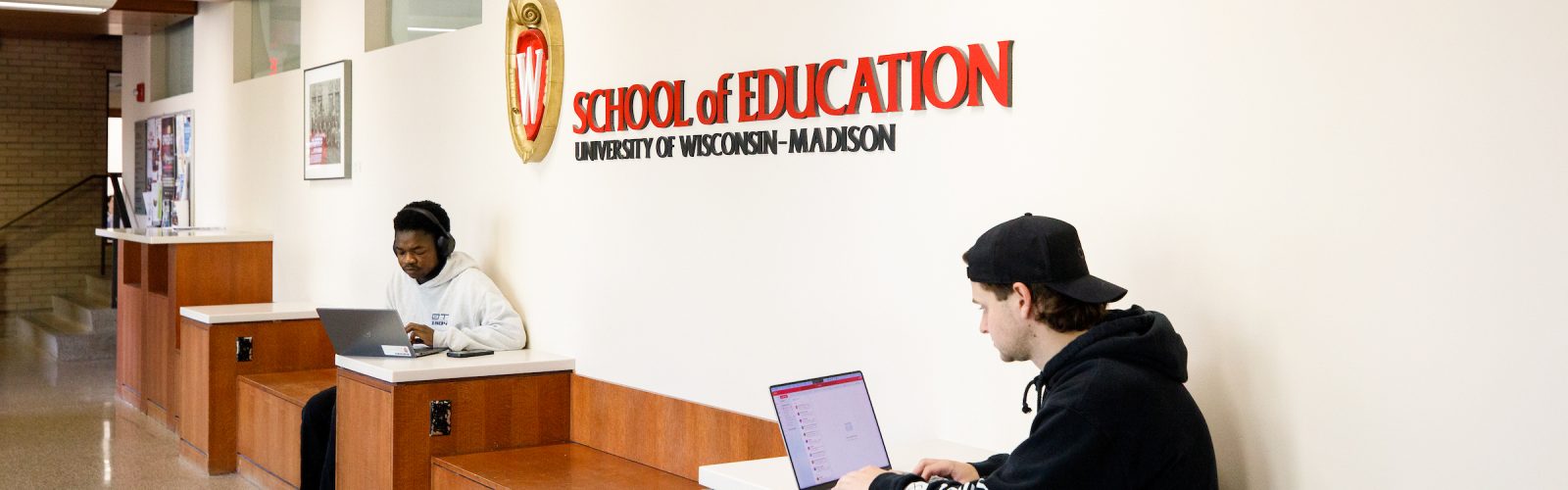 two students studying in a hall